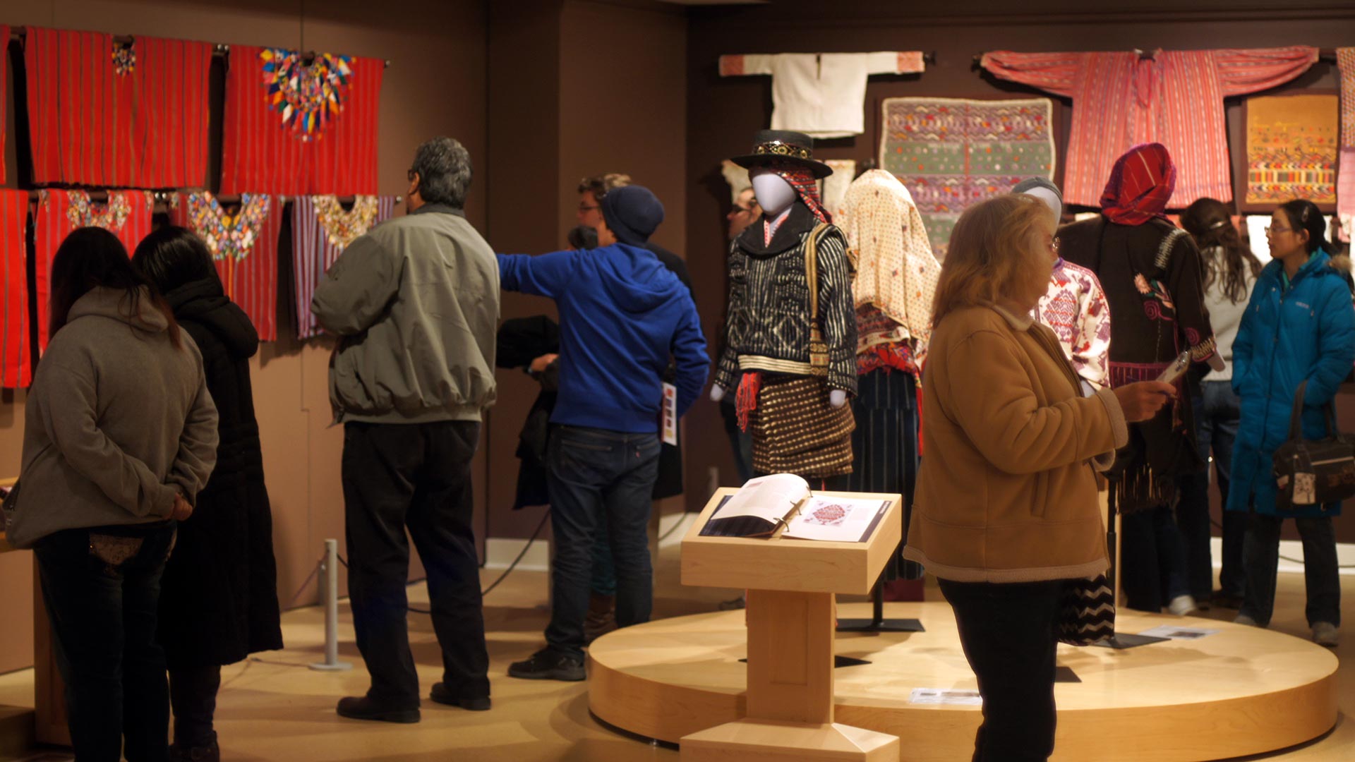 Visitors attending a gallery opening