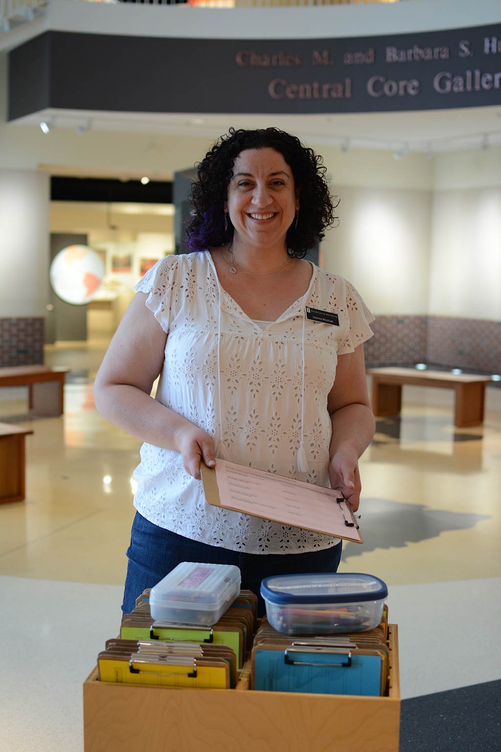 Program assistant with activity cart in Central Core gallery