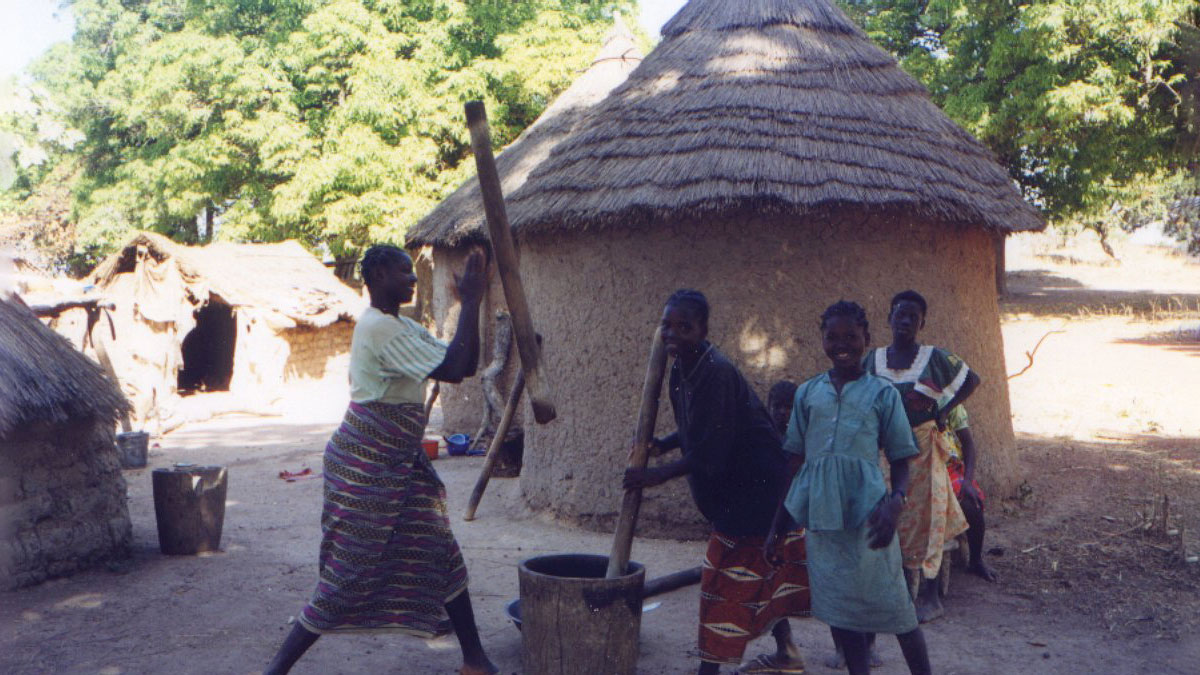 a group of girls pounding food